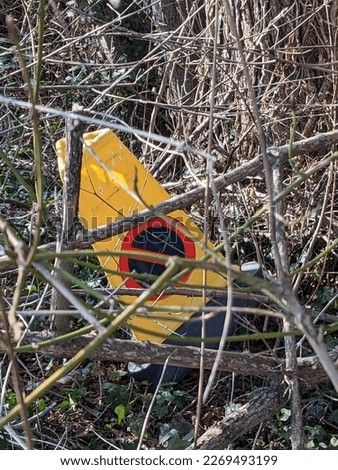 A Abandoned Warning Road Sign the has Been Tipped Over and Discarded