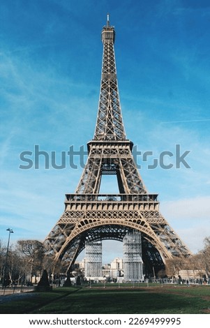 Beautiful photo of the Eiffel Tower made in Paris during a sunny day.
