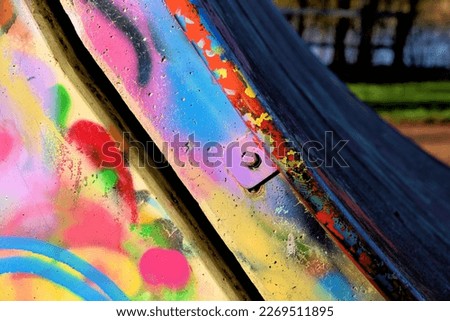colorful graffitti on a concrete halfpipe