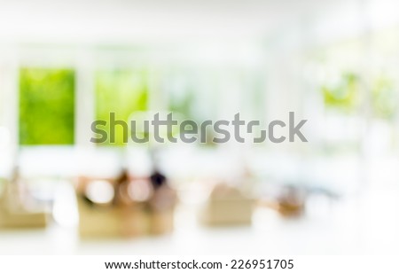 blur image of people sit in living room for background.