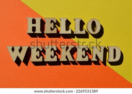 Hello Weekend, words in wooden alphabet letters isolated on bright and colourful background as banner headline Royalty-Free Stock Photo #2269531389