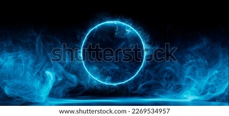 Neon blue color geometric circle on a dark background. Round mystical portal. Mockup for your logo. Futuristic smoke. Mockup for your logo. Royalty-Free Stock Photo #2269534957