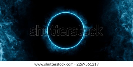 Neon blue color geometric circle on a dark background. Round mystical portal. Mockup for your logo. Futuristic smoke. Mockup for your logo. Royalty-Free Stock Photo #2269561219