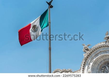 Mexican flag waving with blue sky and clouds and the Bellas artes palace in the background in Mexico City  - Flag Waving, Mexico Flag - Palacio Bellas artes