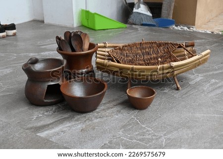 some kitchen utensils like wooden spoon and clay jug, beberapa peralatan dapur seperti sendok kayu dan kendi tanah liat