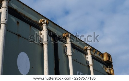 Rusty locks of a shipping container.