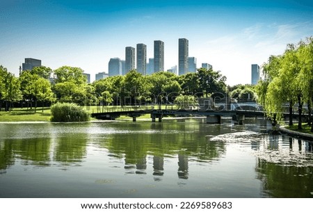 Beautiful city buildings reflected in the water Royalty-Free Stock Photo #2269589683