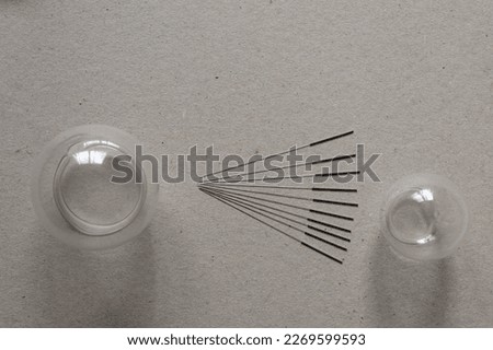 Ten acupuncture needles and two suckers to practice Chinese medicine Royalty-Free Stock Photo #2269599593