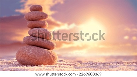Stone tower. Natural pebble stone on the beach. Balancing body, mind, soul and spirit. Mental health practice. Royalty-Free Stock Photo #2269603369