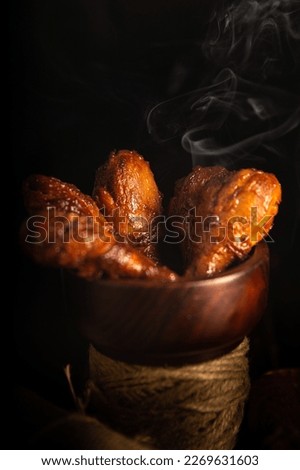 Chicken drumstick with smoke effect 