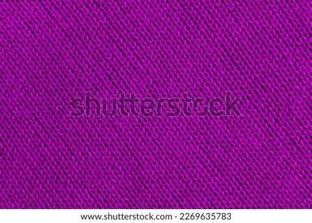 Abstract knitted texture in bright color with diagonal lines.