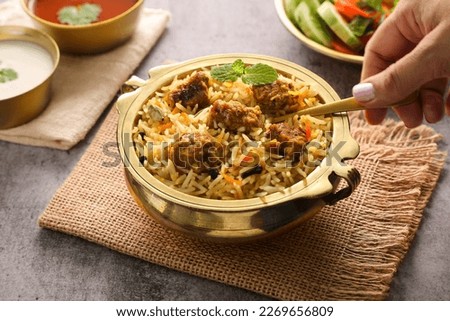 Mutton Gosht Biryani Spicy Indian Malabar lamb meat biryani. Hyderabadi biryani Dum Biriyani pulao beef biryani. Kerala India Sri Lanka Pakistan basmati rice mixed rice dish Ramadan Kareem Eid Royalty-Free Stock Photo #2269656809