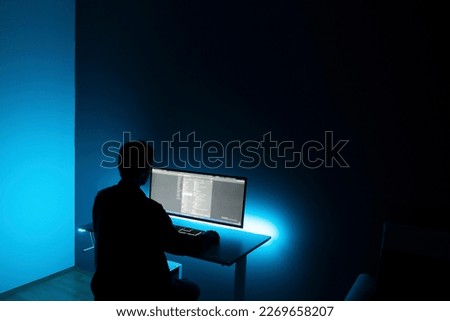 male worker doing job on computer late in the night at home