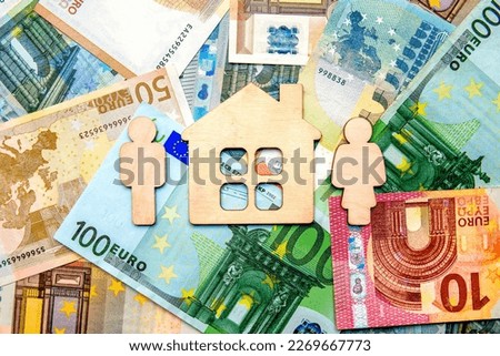 Symbol of home and family against the background of the Euro currency
