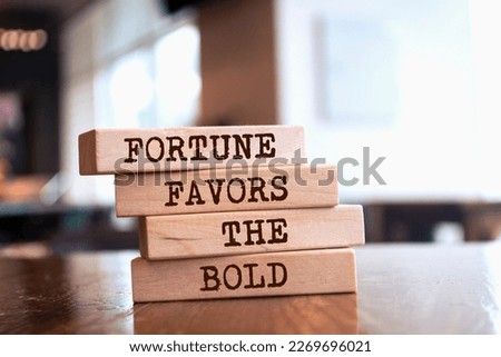 Wooden blocks with words 'Fortune Favors The Bold'.	