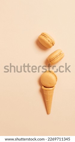 waffle cone with macaroon on paper background