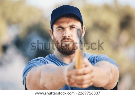 Target, focus and axe throwing with man in nature and aim for sports, training and tomahawk skills. Exercise, goal and hunting with athlete and hatchet in range for bullseye, ready and competition Royalty-Free Stock Photo #2269716307