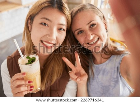 Selfie, portrait or friends take profile picture in cafe with happy smile on holiday vacation or weekend. Social media, Asian or young women smiling in restaurant for fun brunch date with cocktails