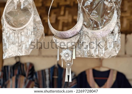 Beautiful traditional Hmong hill tribe silver ornaments for sale as souvenir Royalty-Free Stock Photo #2269728047