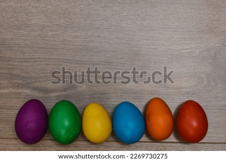 Traditional painted Easter eggs on wooden background. Colorful background of Easter eggs collection, Easter celebration