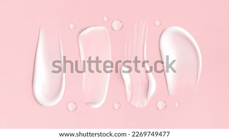 cosmetic smears cream texture on pink background Royalty-Free Stock Photo #2269749477