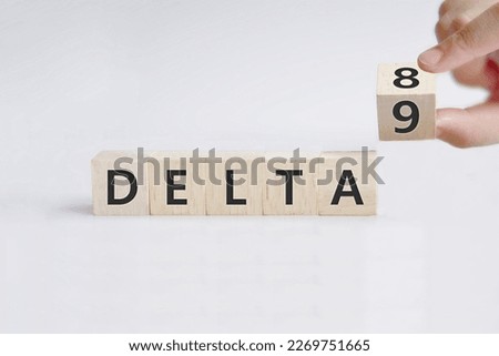 Hand turns dice and changes the expression 'delta 9' to 'delta 8'. Symbol for the Delta-8-tetrahydrocannabinol, a psychoactive cannabinoid found in the Cannabis plant Royalty-Free Stock Photo #2269751665