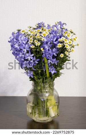 Beautiful bouquet in a vase illuminated by a flash