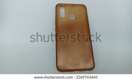 rubber android smartphone case that is dirty and yellowed because it has been used for a long time
