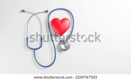 Red heart and a stethoscope on desk, top vew, 3D rendering