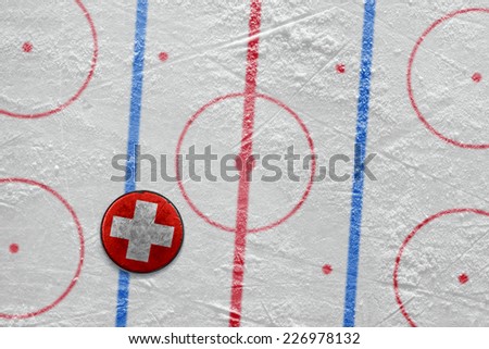 Puck lying on the ice hockey rink. Concept 