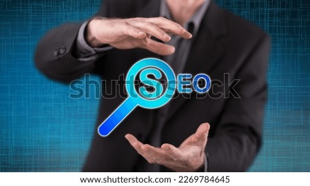 Seo concept between hands of a man in background