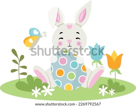 Cute bunny holding a Easter egg in the garden
