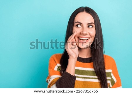 Photo of excited funny woman wear striped sweater arm mouth looking empty space isolated turquoise color background