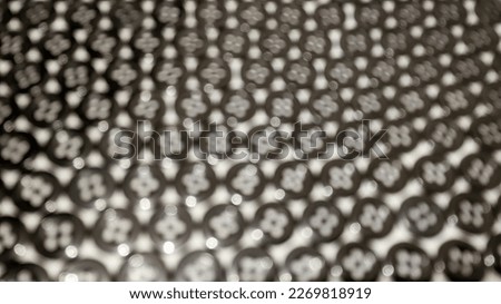 Defocused abstract background of neatly lined black shirt buttons