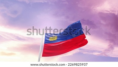 Liechtenstein national flag waving in the sky.