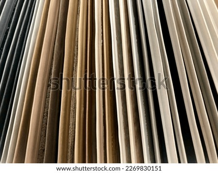Background of closeup wood chipboard samples in the store. Design and decoration, for designers. Production of individual furniture. Design and decoration, for designers