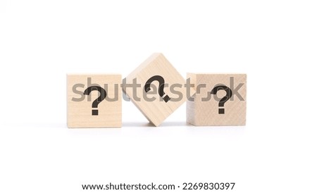 three wooden blocks with a question mark, white background.