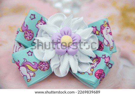Satin ribbon hair bow made with your own hands, hair ornament for girls and women. Royalty-Free Stock Photo #2269839689