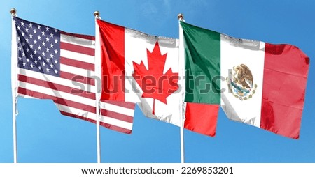 Flags of USA and Canada and Mexico against cloudy sky. waving in the sky
