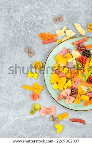 Colorful Italian pasta. Various colors of pasta on the table