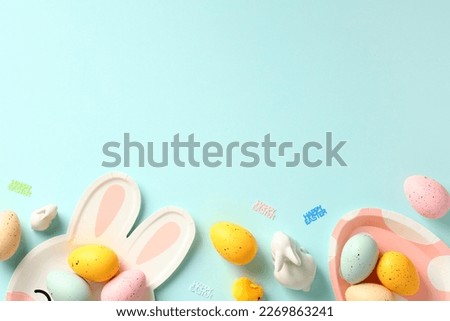 Easter card template. Frame border made of Easter cutlery and colorful Easter eggs. Flat lay, top view.