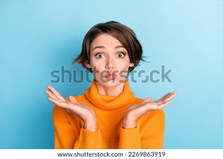 Photo of nice lovely person raise arms palms pouted lips kiss isolated on blue color background