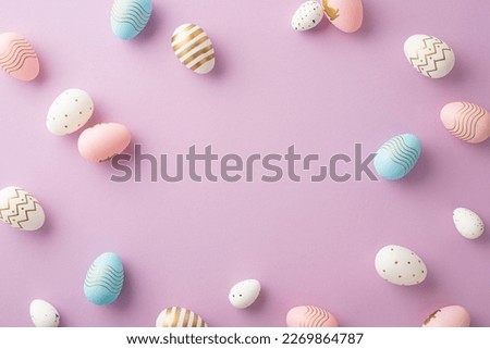 Easter celebration concept. Top view photo of blue pink white and gold easter eggs on isolated pastel violet background with copyspace in the middle