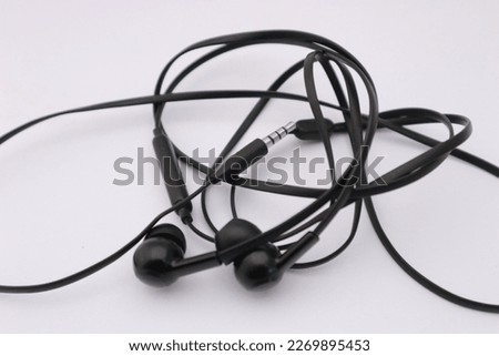 a black in ear monitor isolated on white background
