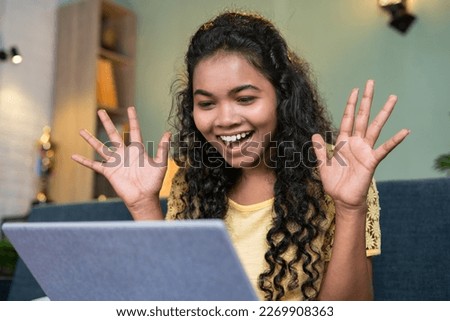Girl got excited after seeing exam results or job offer letter on laptop at home - concept of education, achievement and education Royalty-Free Stock Photo #2269908363