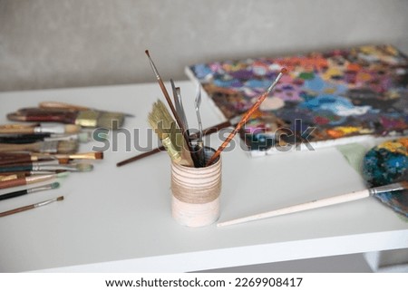 the brushes for drawing white oist palette with paints art