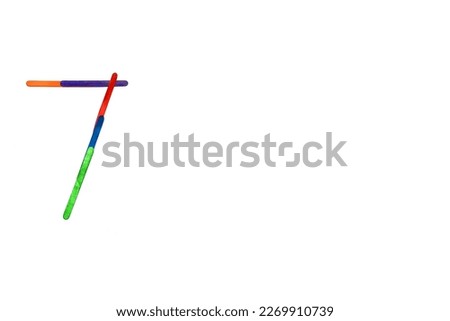 Colorful ice cream sticks arranged in numbers over a white background.