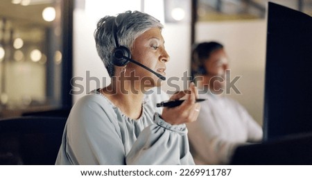 Senior call center employee, woman and phone call, CRM and face, contact us and talking with client and pen. Customer service, telemarketing or tech support, communication and consultant with headset Royalty-Free Stock Photo #2269911787