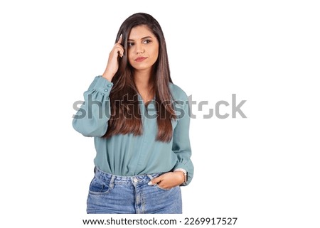 Horizontal photo. Beautiful Brazilian woman, with casual clothes, Jeans and green shirt. sign of reflection, thinking.