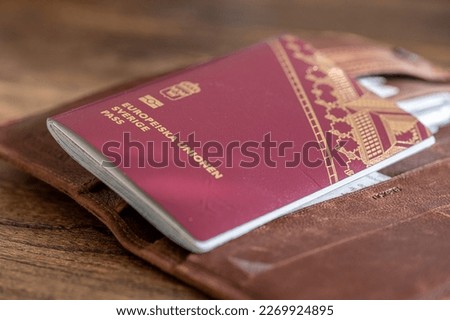 Close-up of a Swedish passport and a wallet for travel documents Royalty-Free Stock Photo #2269924895